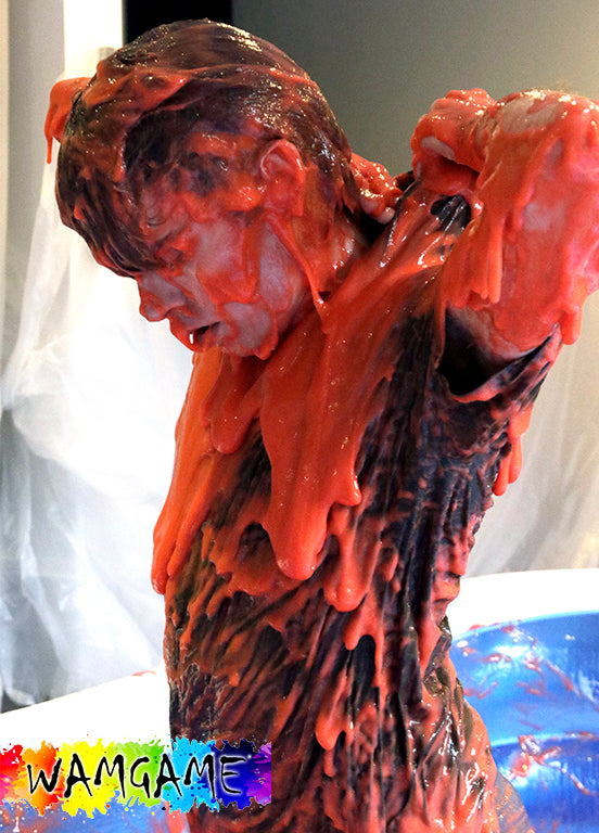 Ben Wallowing in Red & Orange Gunge